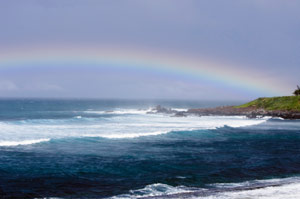 photo of ocean with rainbow